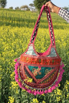 This is a handmade handcrafted very beautifull bag from barmer rajasthan india for multi purpose uses. Material:- -Cotton Cloths -Handmade items -Handmade designs -Embroidery -Embroided Front Usage Of Purpose:- -College -Market -Holidays Care Instructions:- -Wash it and dry it in the shade. Multicolor Shoulder Bag With Dori Work For Festivals, Bohemian Bags With Dori Work, Multicolor Handwork Potli Bag For Festivals, Bollywood Style Shoulder Bag For Festivals, Handmade Multicolor Embroidered Shoulder Bag For Festivals, Bohemian Multicolor Bags With Zari Work, Handmade Shoulder Bag With Multicolor Embroidery For Festivals, Embroidered Multicolor Shoulder Bag For Festivals, Green Bohemian Bags For Festivals