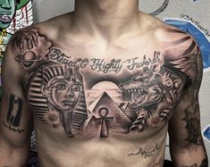 a man with tattoos on his chest has an egyptian scene and pyramids in the background