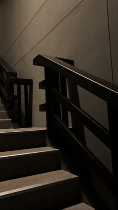 some stairs and railings in a dark room