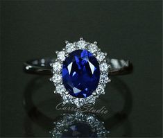 Classic Royal Blue Halo Style Lab Sapphire ring, classic collection for this style ring, beautiful and elegant anniversary gift, or promise ring. Material: Made with 925 sterling silver, plated with white gold. Main Stone: Lab Created Sapphire Dimension: 7*9 mm, about 2ct Side Stone: CZ CS024 Processing time: 10-15 days Ship by express shipping when it's ready. Custom order accepted, if need different stone or material, just feel free to contact.:) Home page: https://www.etsy.com/shop/CarrieStud Elegant Sapphire Diamond Ring For Promise, Elegant Sapphire Diamond Promise Ring, Elegant Royal Blue Gemstone Rings, Elegant Royal Blue Sapphire Ring As Gift, Elegant Royal Blue Sapphire Ring With Center Stone, Elegant Royal Blue Sapphire Ring Gift, Elegant Royal Blue Brilliant Cut Rings, Elegant Diamond Ring With Lab-created Sapphire For Promise, Elegant Lab-created Sapphire Diamond Ring For Promise