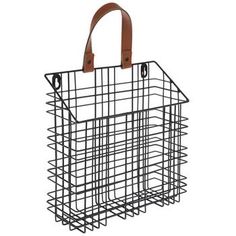 a black wire basket with leather handles on the front and back sides, hanging from a hook