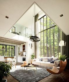 a living room filled with furniture and large windows