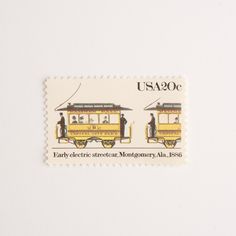 a postage stamp with two trolley cars on it's side and the words, usao