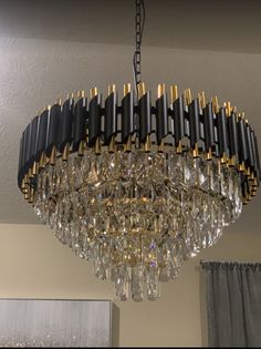 a chandelier hanging from the ceiling in a room