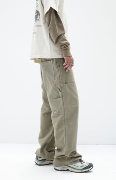 Discover practicality and style in PacSun's Olive Extreme Baggy Carpenter Jeans. Featuring utility pockets, a signature woven tag, spacious back pockets, and side entry pockets, these jeans are designed in an olive wash with durable seams. They boast a baggy fit with a wide leg opening for a relaxed, comfortable silhouette that merges utility with contemporary fashion.


	Model is wearing size 32
	Model Measurements: 6'0” Height, 28" Waist, 34” Chest, 32” Hips Cargo Jeans Outfit Men, Baggy Jeans Design, Baggy Pants Fashion, Cargo Pants Men Fashion, Carpenter Pants Outfit, Cargo Jeans Outfit, Mens Bottoms, Utility Wear, Baggy Carpenter Jeans