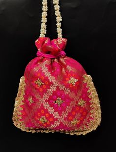 fancy indian handmade woman embroider potli bag | magenta pink flower evening purse | ethnic ladies fabric purse with beaded handlePackage Contents: 1Size: 10" x 8"Designed with the heart, this beautiful Potli or batawa bag are eye catchy and made of premium material.Key Features:Embroidery art work. This potli is good match with both Indian and western outfits and are superb for wedding and festive parties.This would be best complement to your designer saree, lenhga or any other kind of dress.T Multicolor Potli Bag With Dori Work For Festivals, Multicolor Potli Bag With Dori Work For Diwali, Traditional Potli Bag With Resham Embroidery For Festivals, Traditional Pink Pouch For Festive Season, Festive Pink Potli Bag For Celebrations, Pink Zari Work Potli Bag For Party, Traditional Pink Pouch For Festive Occasions, Traditional Pink Bag For Festive Occasion, Traditional Pink Bag For Celebration