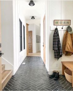 the hallway is clean and ready to be used as a mud room or office space