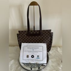 Please View All Photos And Read Entire Description For Our Preloved Luxury Items As They Are Not New And Will Most Likely Have Minor Cosmetic Issues. We Do Not Accept Returns So Please Ask Any Questions Prior To Purchasing Or Bidding. This Is An Authentic Louis Vuitton Partilo Shoulder Bag With A Certificate Of Authenticity. The Bag Features A Beautiful Brown Exterior Color With A Canvas Material And A Magnetic Closure. The Bag Is Designed For Women And Has A Brown Handle/Strap Color With A Canv Square Monogram Canvas Shoulder Bag For Everyday, Everyday Square Monogram Canvas Shoulder Bag, Brown Monogram Canvas Square Shoulder Bag, Square Brown Monogram Canvas Shoulder Bag, Brown Square Satchel With Branded Hardware, Monogram Canvas Tote Shoulder Bag For Office, Office Tote Shoulder Bag In Monogram Canvas, Office Monogram Canvas Tote Shoulder Bag, Brown Business Shoulder Bag With Dust Bag