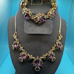 "Vintage 1954 Hollycraft Copr Signed Bracelet featuring purple crystal spiders with matching necklace. Gorgeous mid-century jewelry set. Bracelet is 7 1/4\" long and has hinged clasp with a safety chain. Spiders measure 3/4' x 3/4\". Necklace is 13.5\" long, adjustable to 15.5\". Small spiders are 1\" x 3/4\". The large spider is 1 1/8' x 1\". Beautiful set in excellent condition! No missing stones. Due to the value of this set it will be shipped Priority Mail with insurance." Vintage Purple Hallmarked Jewelry, Antique Hallmarked Purple Necklace, Elegant Purple Multi-stone Necklaces, 4 Necklace, Large Spiders, Luxury Amethyst Multi-stone Necklaces, Luxury Amethyst Multi-stone Necklace, Spider Necklace, Set Bracelet