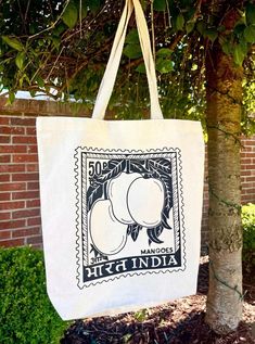 Handmade tote bag with a vintage Indian Postage stamp.  Durable tote bag, made of 100% cotton with durable heavy duty handles. Size: 14.5"W x 14"H x 3"D Vintage Cotton Canvas Bag With Large Capacity, Vintage Cotton Shopping Bag, Vintage Canvas Gift Bag, Large Eco-friendly Canvas Shoulder Bag, Eco-friendly Hand Printed Canvas Bag For Everyday Use, Vintage Cotton Shoulder Bag For Shopping, Vintage White Cotton Shoulder Bag, Eco-friendly Cotton Shopping Bags, Eco-friendly Hand Printed Canvas Bag For Daily Use