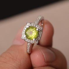 This is a gorgeous handmade creation. Its beauty is its simplicity & Elegance. The 7*7mm round cut natural peridot is crafted in solid sterling silver and with rhodium plated. It is available to customized, if you have any mind, just let me know, we will discuss with it. All item is sent in a beautiful gift box You can realize more lovely stuff clicking the link https://www.etsy.com/shop/knightjewelry?refshopsection_shophome_leftnav Please leave the correct address and you PHONE NUMBER for d Elegant Peridot Birthstone Gemstones, Fine Jewelry With Round Cut Peridot, Lime Green Gemstone Birthstone Ring As Gift, Lime Green Gemstone Birthstone Ring For Gift, Lime Green Birthstone Ring As A Gift, Lime Green Gemstone Ring Jewelry, Lime Green Gemstone Ring, Silver Peridot Birthstone Ring With Accent Stones, Silver Birthstone Ring With Peridot And Accent Stones