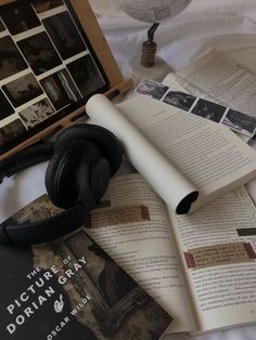 an open book with headphones on top of it