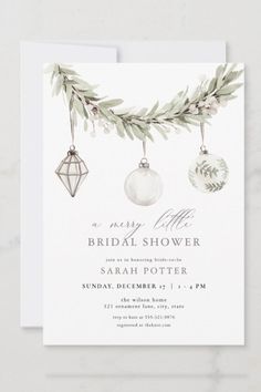 an elegant bridal shower with ornaments and greenery on the front, is shown