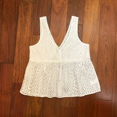 American Eagle Outfitters White Sleeveless Eyelet Top V-Neck, Babydoll Style Top Eyelet Pattern, See-Through Size M Nwt White V-neck Vest Top, Summer Cotton V-neck Vest, Spring Cotton Lace Top With V-neck, White V-neck Camisole For Vacation, Fitted V-neck Summer Vest, Casual V-neck Lace Top For Summer, Chic V-neck Beach Vest, Spring V-neck Crochet Top, White V-neck Lace Top For Vacation