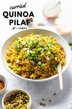 quinoa pilaf in a white bowl with spoons next to it