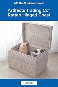 the container store artifacts trading co rattan hinged chest with stuffed animals in it