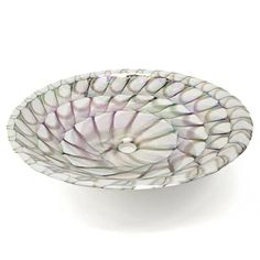 a glass bowl that is sitting on a table