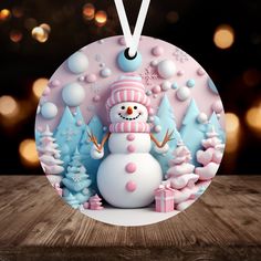 a snowman ornament hanging from a wooden table