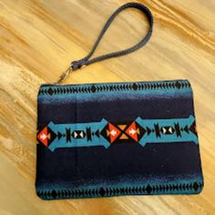 Individual Monitor Settings May Affect Color Display... New- Southwestern Theme Wristlet Wristlet Style Envelope Bag Beautiful Western Sarape Stripe Geometric Print On Cotton Blue Cotton Lining Fabric Rectangle Shape Wrist Strap Handle Makes It Perfect For Hanging On A Hook In The Bathroom, Clipping Into A Larger Bag And Pretty Enough To Carry As A Primary Clutch Going Out Envelope Style Wallet. Matching Dark Blue Metal Zip Closure It Is A Perfect Size For Travel Or Daily Use With Dimensions Of 8"X6"X Flat (W X H X D). Plenty Of Room For Phone, Cards, Cash And Travel Make-Up Essentials. Hand Crafted. Stand Out With Unique Hand-Crafted Gifts While Supporting A Small Business Owner. Th Handcrafted Bags, Western Theme, Cosmetics Bag, Envelope Bag, Craft Bags, Hand Crafted Gifts, Blue Teal, Large Bag, Lining Fabric