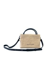 A tiny crossbody bag in wrinkled eco leather.Has two short handles and a detachable flat strap.Lined interior. No extra pockets. Hidden magnet closure.Exterior with Distyled logo print.Size:Bag size: Height - 13cm/ Width - 20cm/ Depth - 5cm.Strap size: Width - 1.5cm/ Length max - 120cm.Care:Please use soap foam and a sponge for cleaning your Distyled bag.Things to know:This bag is made of vegan leather called microfiber and its most premium of all other vegan leathers. It is a versatile textile Small Bags With Detachable Handle For Everyday Use, Small Bag With Detachable Handle For Everyday Use, Small Everyday Bag With Detachable Handle, Small Bags With Adjustable Strap For Daily Use, Small Bag With Adjustable Strap For Daily Use, Small Everyday Leather Bag, Trendy Small Shoulder Bag For Everyday Use, Small Shoulder Bag With Detachable Strap, Mini Shopping Bag