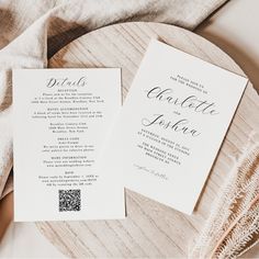 two wedding programs sitting on top of a wooden plate