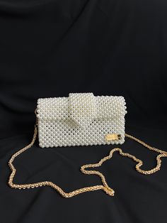 Bead bags are 100% handmade. Bead strap length can be changed upon request. It fits phone, card holder, lipstick, earphone case. It will come with a special pouch. * Dimensions - Width: 22 cm - Height: 13 cm - Depth: 6 cm - Strap Length: 110 cm * Materials - Luxury Plated Pearl - Gold Material * Shipping - Ships worldwide from İstanbul, Turkey. - Production time before shipment is 2-7 working days. - 2-5 business days is for USA shipment. ☆☆ Note: Strap size can be changed according or color of the pearl to your request. Please contact us for any changes you want to make to the product. ☆☆ It can be created to your requests bigger, smaller with the same style. For custom-making this bag, please leave us a message.  ♡ Thank you for shopping from my small business! ♡ AtelierofDream Elegant Clutch Phone Bag As Gift, Elegant Shoulder Phone Bag As Gift, Elegant Square Phone Bag As Gift, Elegant Rectangular Phone Bag For Party, White Rectangular Phone Bag For Party, Beaded Rectangular Phone Bag For Parties, Rectangular Beaded Phone Bag For Parties, Party Beaded Rectangular Phone Bag, Rectangular Bag With Beaded Chain For Gift