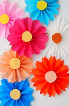 colorful paper flowers arranged on top of each other