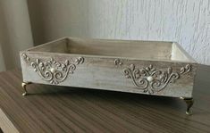 a wooden tray sitting on top of a table