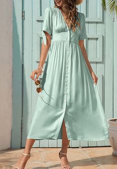 The EMES SHOP dress is detailed with fun tie sleeves. Features a v neck line. button down design. short sleeves. flowy dress. and mid-calf length. Pair it with sunnies and espadrilles for a magnificent summer look.MATERIALS: 91-99 % PolyesterMEASUREMENTS: Product length is 50"-51.9" 4-6-Small | Waist: 25-26.5 in | Chest: 33-34.5 in | Hips: 35-36.5 in 6-8-Medium | Waist: 26.5-28 in | Chest: 34.5-36 in | Hips: 36.5-38 in 8-10-Large | Waist: 28-29.5 in | Chest: 36-37.5 in | Hips: 38-39.5 in 10-12-X Summer Button-up Midi Dress, Casual Mid-length Midi Dress For Beach, Summer Button-up Midi Dress With Button Closure, Summer Midi Dress With Buttons For Day Out, V-neck Summer Dress With Tie Sleeves, Casual Button-up Beach Season Dress, Summer Dresses With Button Closure, Casual Button-up Dress For Beach Season, Buttoned Midi Dress For Summer Vacation