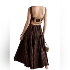 Cult Gaia Evening Gown "Slipping Into Something More Comfortable Takes On A Different Meaning With Cult Gaia And This Ruched Satin Maxi Dress, The Angela. The ""Soil"" Brown Design Has A V-Neckline Which Leads Into A Yoked, Empire Waist Before Falling Into An Ankle-Length Skirt. Note The Open Back With An Oversized Buckle Detail When Posing For Those Golden-Hour Photos. Cult Gaia Angela Ruched Satin Maxi Dress"Pleated Accents Sleeveless With V-Neck Concealed Zip Closure At Side Estimated Item Me Brown A-line Midi Dress For Evening, Backless Brown Maxi Dress For Party, Brown Backless Maxi Dress For Party, Brown Backless Dress For Date Night, Elegant Brown Backless Maxi Dress, Glamorous Sleeveless Brown Dress, Brown Spaghetti Strap Maxi Dress For Party, Elegant Brown Slip Dress For Party, Chic Brown Midi Dress With Spaghetti Straps