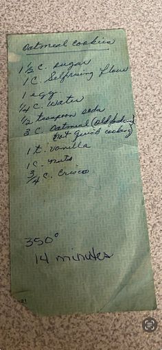 a piece of green paper with writing on it