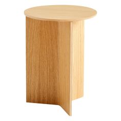 a round wooden table with no legs on the top and one leg in the middle