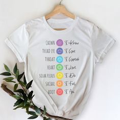 This stylish unisex '7 Chakra Affirmations White Shirt' white t-shirt fits like a well-loved favorite. Super soft cotton and excellent quality print make one fall in love with it over and over again. It feels soft and lightweight, with the right amount of stretch. It's comfortable & flattering for both men and women.
This t-shirt is a perfect gift for anyone who loves chakras, spirituality, yoga, and meditation.
This tee is made out of 100% soft spun cotton. Get yours Seven Chakra t-shirt today! Spiritual Clothing, Chakra Affirmations, Chakra Colors, Candle Ideas, Sanskrit Words, Chakra Yoga, Seven Chakras, Color Meanings, 7 Chakra