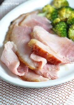 ham and broccoli on a white plate with the words honey - orange glazed ham