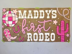 a sign that says maddy's best rodeo on the side of a wall