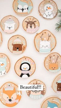 the wall is decorated with wooden plates and magnets that have different animals on them