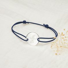 Treasure the talent of your little artist with our Drawn by you Personalized Large Pastille Bracelet. Featuring a stylish braid and large pastille disc lovingly engraved with your chosen design and hand-engraved message, create a uniquely sentimental gift to cherish. 925 Sterling SilverCharm: 0.8”x0.8”Braid made of durable, colorfast polyesterSize: between 8-9, fully adjustable sliding knot fasteningEngraved by hand in our Paris workshopSent with love in a complimentary gift boxAny slight variat Adjustable Engraved Round Disc Bracelet, Adjustable Round Disc Bracelet As Gift, Adjustable Round Disc Bracelet Perfect As Gift, Adjustable Round Disc Bracelet For Gift, Adjustable Name Bracelet With Engraving Option, Engraved Bracelet, Sliding Knot, Sentimental Gifts, Your Man