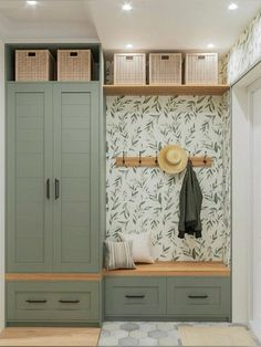 a room with some green cabinets and drawers