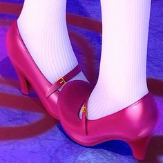 a woman's feet with white socks and pink shoes