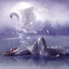 a woman laying on top of a body of water with a swan flying over her head