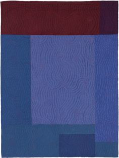 a blue, red and purple patchwork quilt