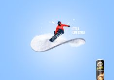 a snowboarder is in the air with his board