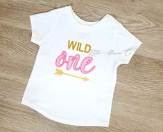 Welcome to our shop, LittleAlessiaCo! All items are handmade and may vary slightly in color and size from photOWild One T-Shirt  - It can be customized for ages 1-2  - The Shirts are 100% cotton and super soft. Below is a list of sizing and washing instructions for our products!We are open to custom orders and designs, so please send us a message!OUR CURRENT turn around time is 3-4 business days. Unless listed otherwise in shop announcementsAny of our listing's can be done on T-shirtsIf you like Cute Custom Print T-shirt For First Birthday, Frozen First Birthday, Pink Crew Neck Shirt For First Birthday, Customizable White T-shirt For First Birthday, First Birthday T-shirt With Text Print, Mickey Mouse Birthday Shirt, Fun Pink T-shirt For First Birthday, Space Shirts, One Year Birthday