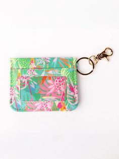 a keychain with a flower print on it and a small pocket for keys