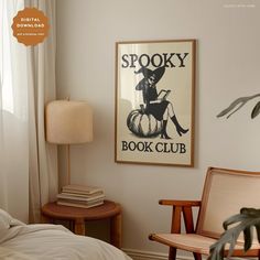 a room with a poster on the wall and a rocking chair in front of it