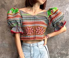 This so so Beautiful Ethnic (Hmong) crop top, 100% hand Embroidered top. With balloon sleeves. Super Unique crop top The sleeves will stay like in the pic, not falling down. The fabric is hemp with the zipper on the side. Size : Bust 36 inch, Waist 34 inch, Length 15 inch. Multicolor Cotton Cropped Crop Top, Embroidered Fitted Bohemian Crop Top, Multicolor Patchwork Crop Top, Ethnic Crop Top, Multicolor Cropped Hippie Crop Top, Bohemian Multicolor Printed Crop Top, Unique Crop Tops, Hmong Fashion, Modest Dresses Fashion