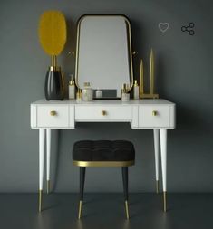 a dressing table with a mirror, stool and other items on it in front of a gray wall