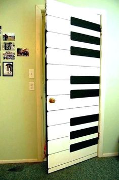 an open door with piano keys painted on it