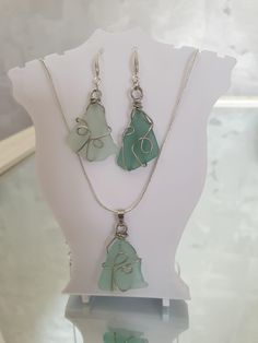 Embrace the calming hues of the Baltic Sea with this one-of-a-kind seaglass jewelry set! This handmade set includes a pair of earrings and a matching pendant, each featuring naturally tumbled light blue seaglass pieces collected from the shores of the Baltic Sea this summer. The seaglass is wrapped in copper wire for a rustic, boho-chic look, and both the earrings and the pendant feature 925 sterling silver components. Earrings: Each earring is approximately 5 cm long (including hooks), with the Seaglass Jewelry, Sea Glass Pendant, Blue Sea Glass, Nature Inspired Jewelry, Chic Look, Baltic Sea, 925 Sterling Silver Chain, Ocean Inspiration, Sea Glass Jewelry