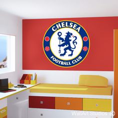 the chelsea football club logo is on the wall in this kids's playroom